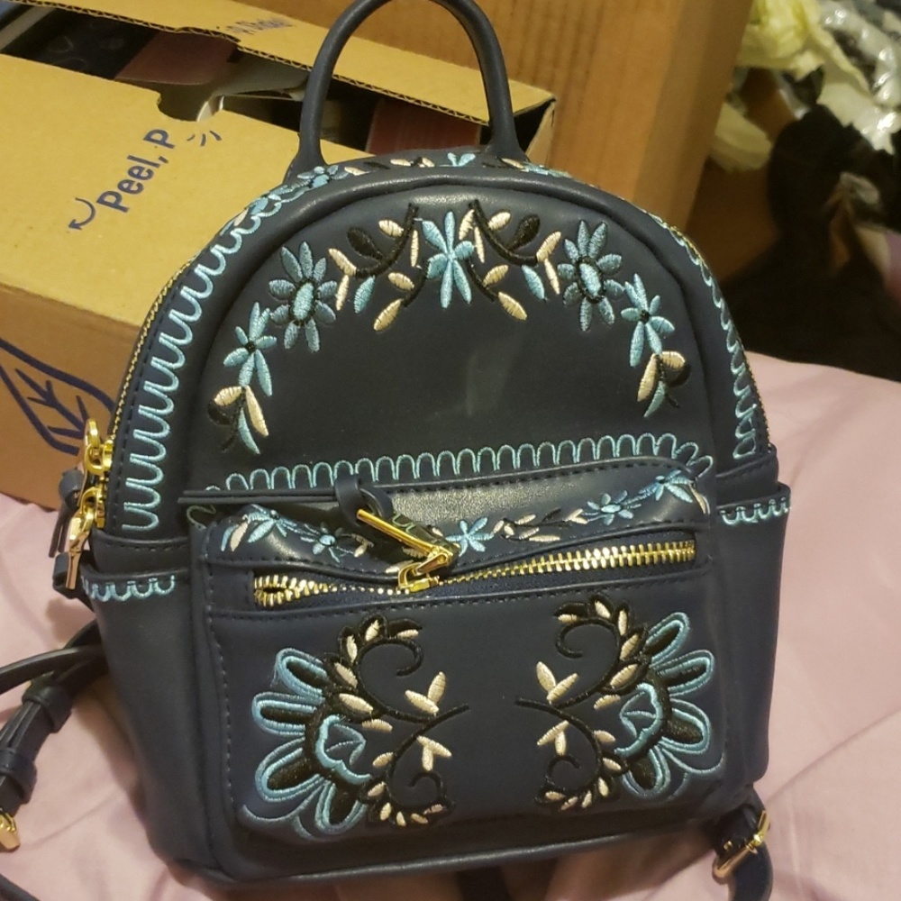 Leather embroidered mini backpack